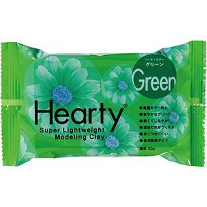 A package of green modeling clay with a flower design on it.