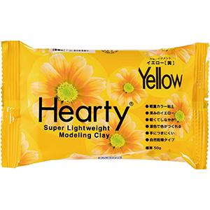 A package of yellow modeling clay with a flower design on it.