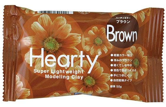 A package of brown modeling clay with a floral design.