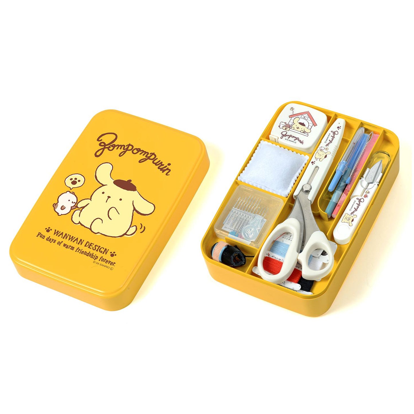 a yellow tin box with various sewing and crafting supplies, including scissors, needles, and other tools.