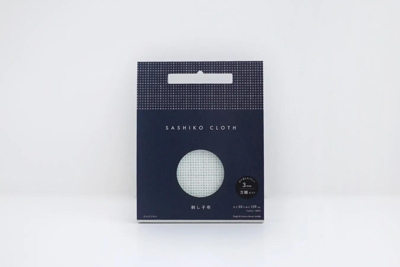 A package of Sashiko cloth, which is a type of fabric. The package is dark blue with a white circular design on the front.