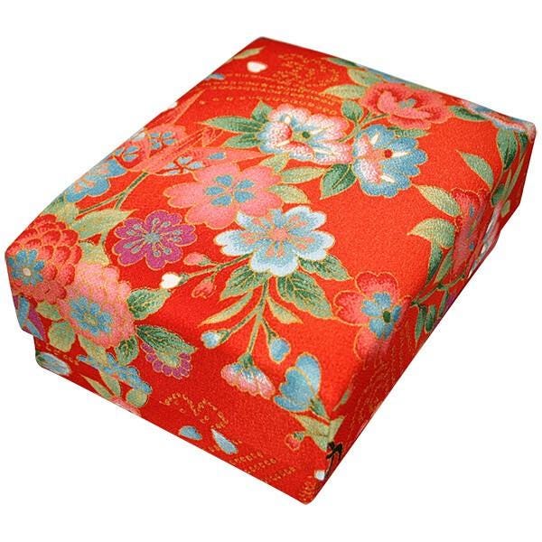 a red box with a floral pattern on it.