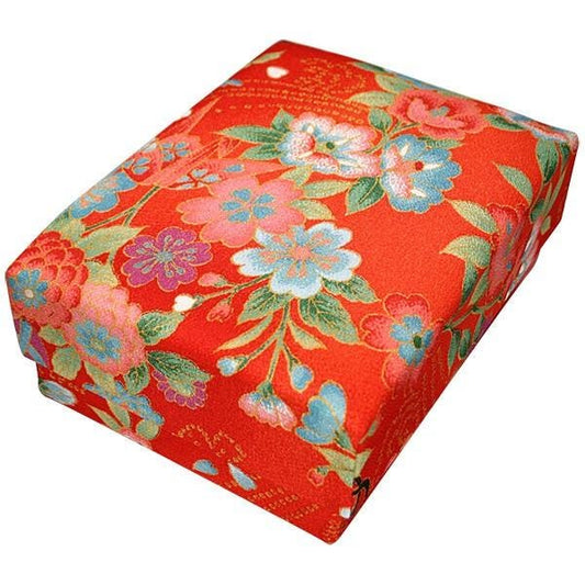a red box with a floral pattern on it.
