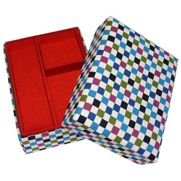 a colorful checkered box with a red compartment, placed on a white background.