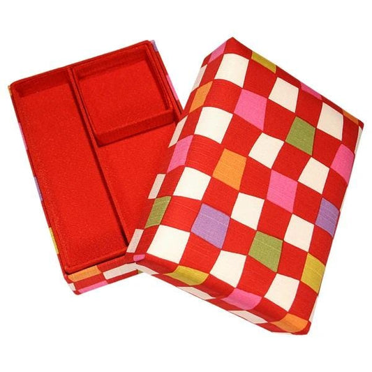 a red and white checkered box with a red compartment, placed on a white background.