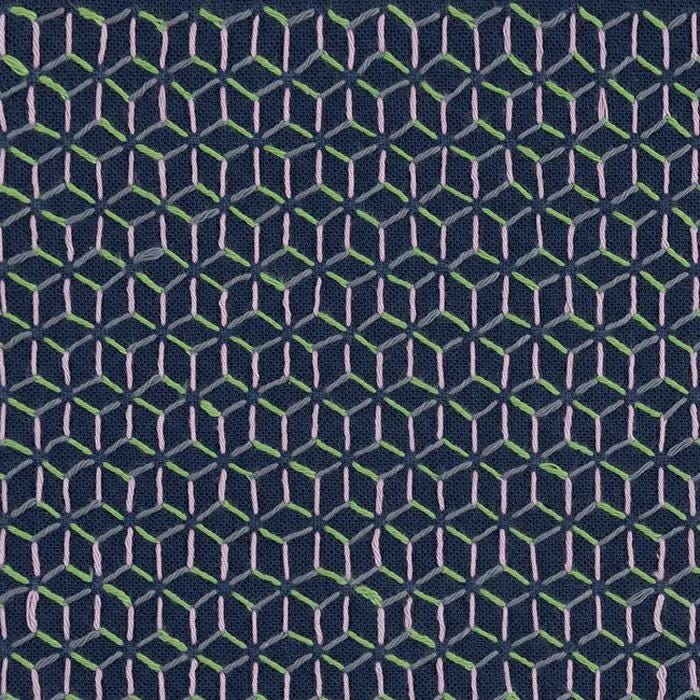 a repeating pattern of green and purple hexagonal shapes on a dark background.
