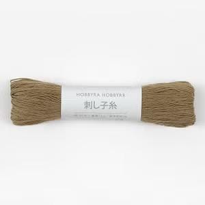 A spool of brown thread with the label "HOBBYRA HOBBYRE" and Japanese text.