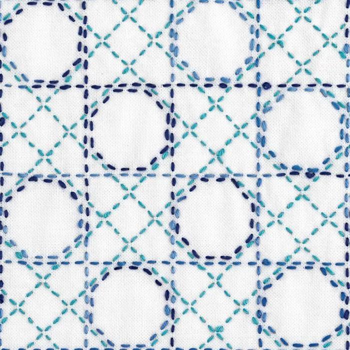 a repeating pattern of blue and white circles and lines, creating a visually striking and intricate design.