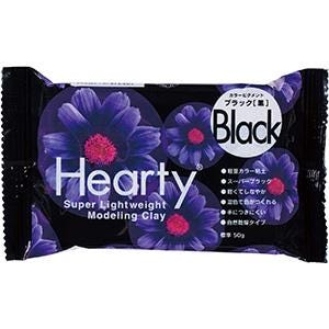 A package of black modeling clay with a purple flower design.