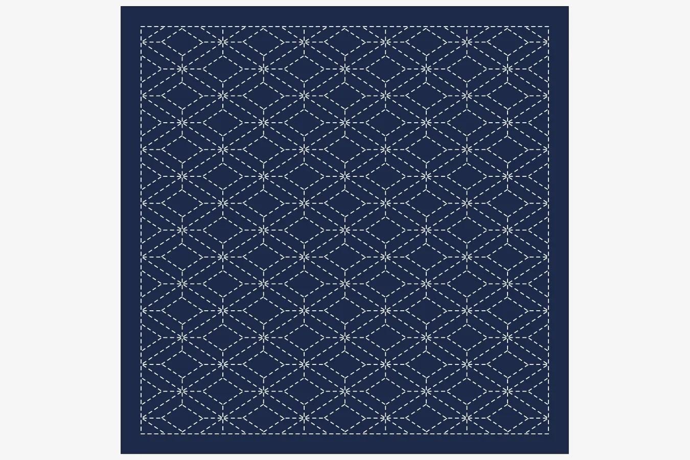 a blue and white geometric pattern with a repeating diamond shape design.