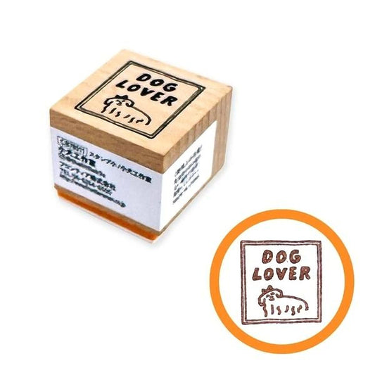 a wooden stamp with the phrase "DOG LOVER" printed on it, along with a small circular stamp that also says "DOG LOVER".