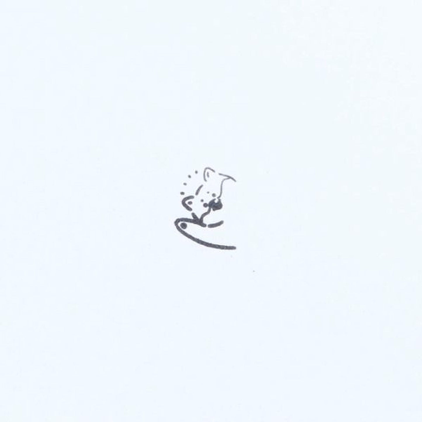 A simple black and white line drawing of a small animal, likely a cat, sitting on a surface.