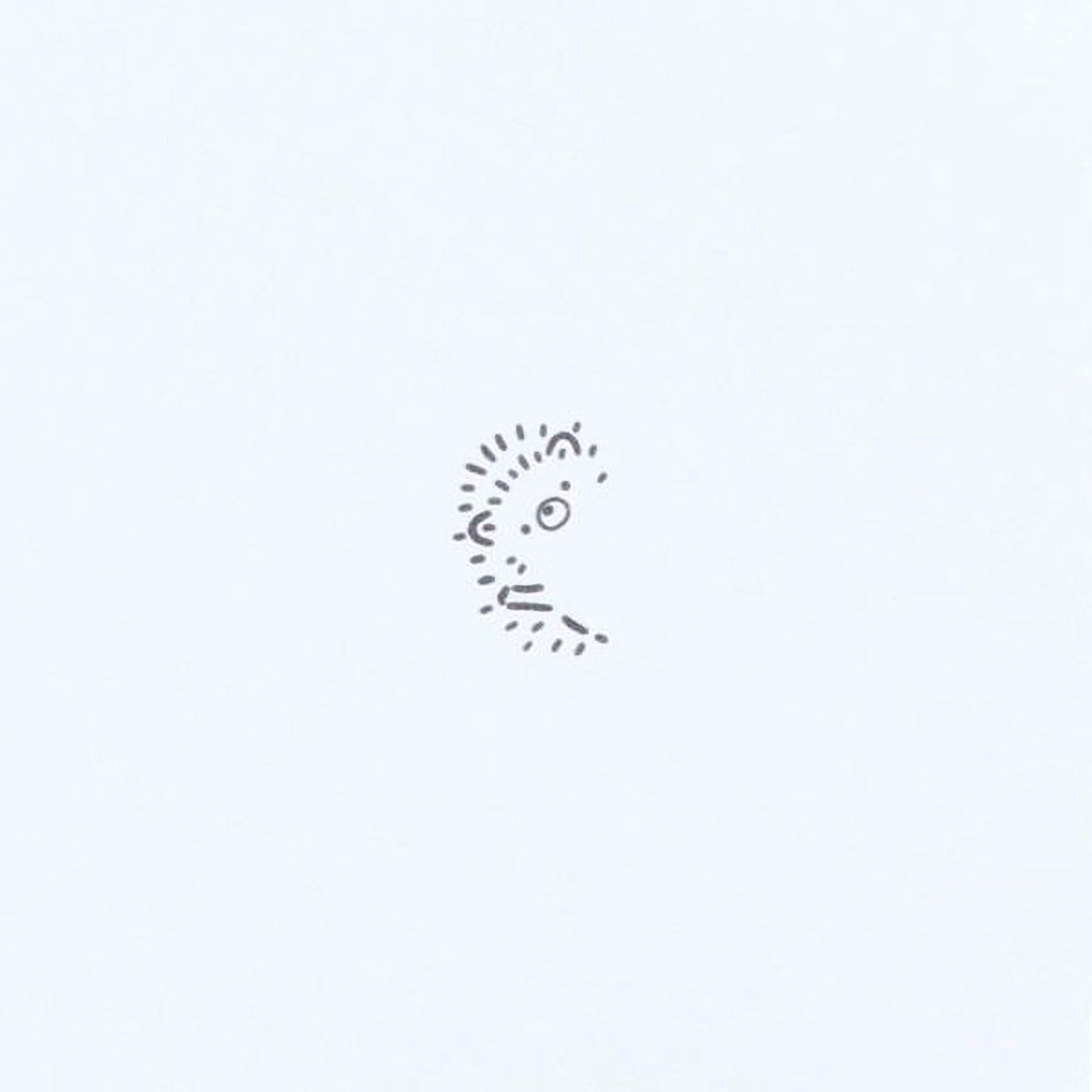 A simple black and white line drawing of a face or profile against a plain white background.
