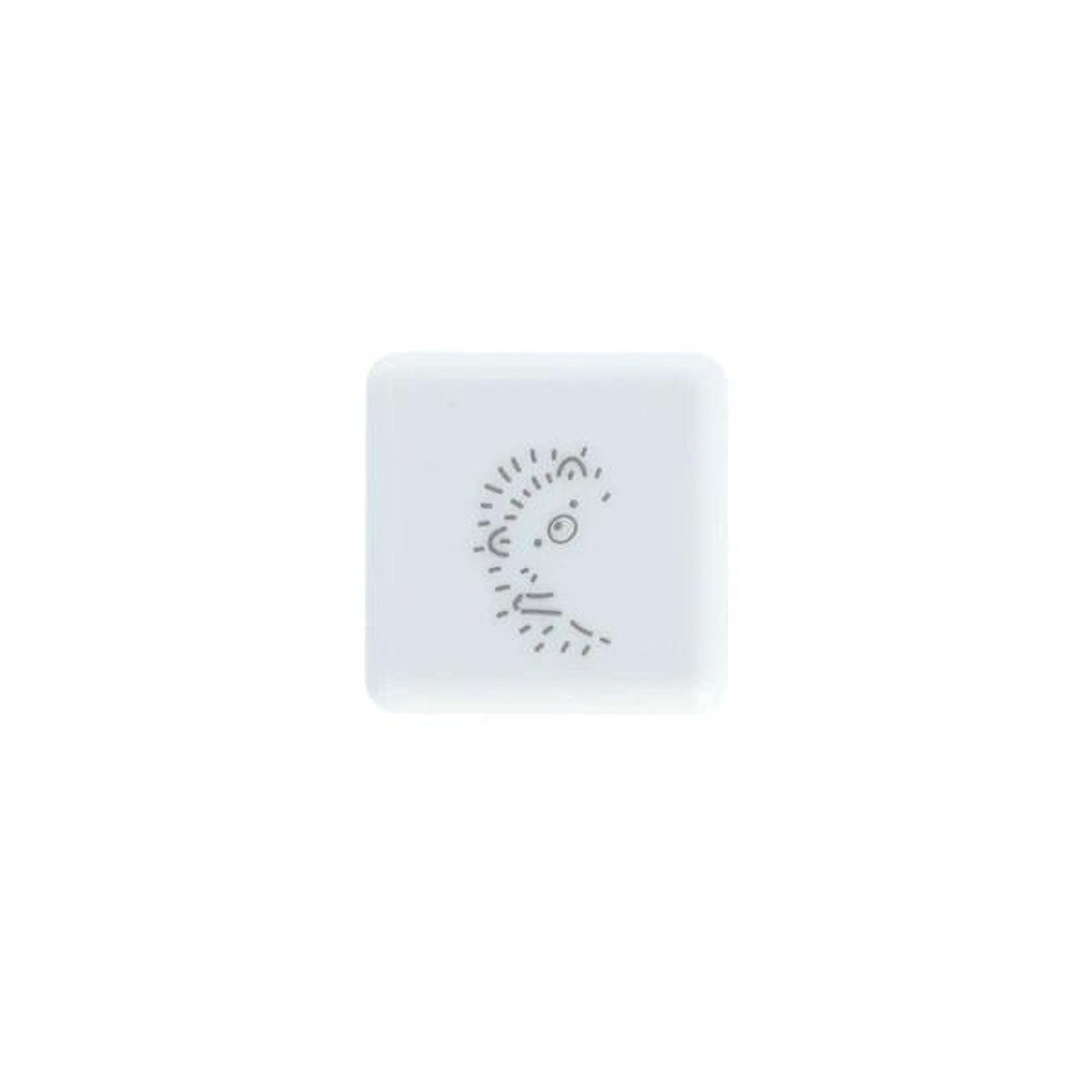 A square white button with a simple black line drawing of a face on it.