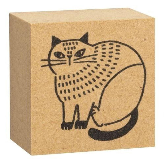 A block of brown cardboard with a black illustration of a cat on it.