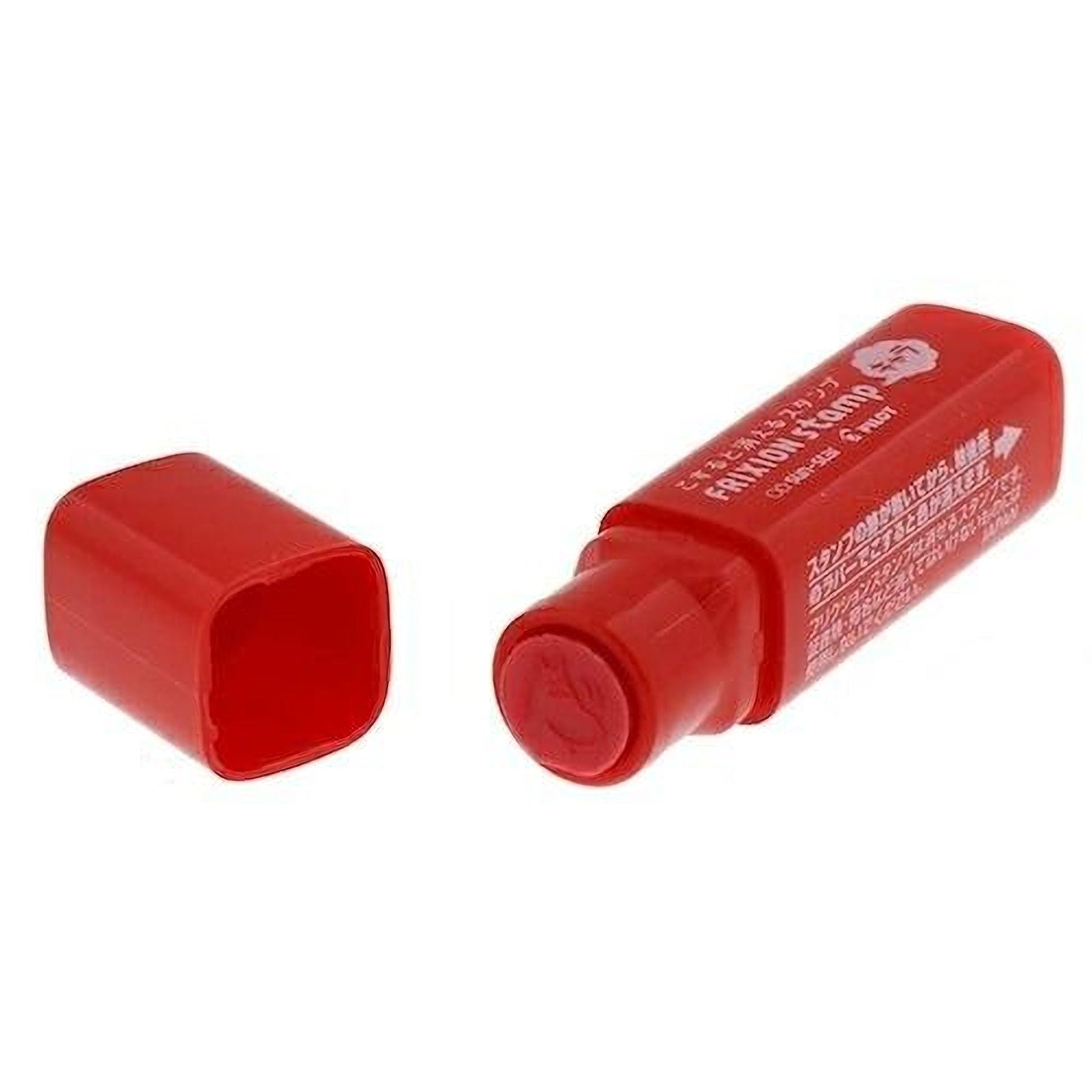 A red plastic marker with a white label, lying on its side with the cap off.