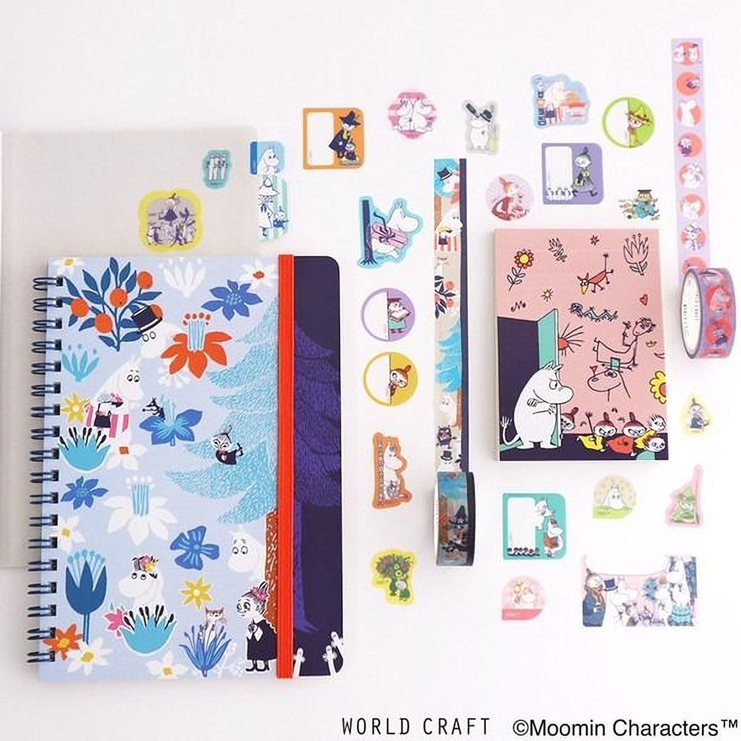 various items related to Moomin characters, including notebooks, stickers, and other decorative elements.