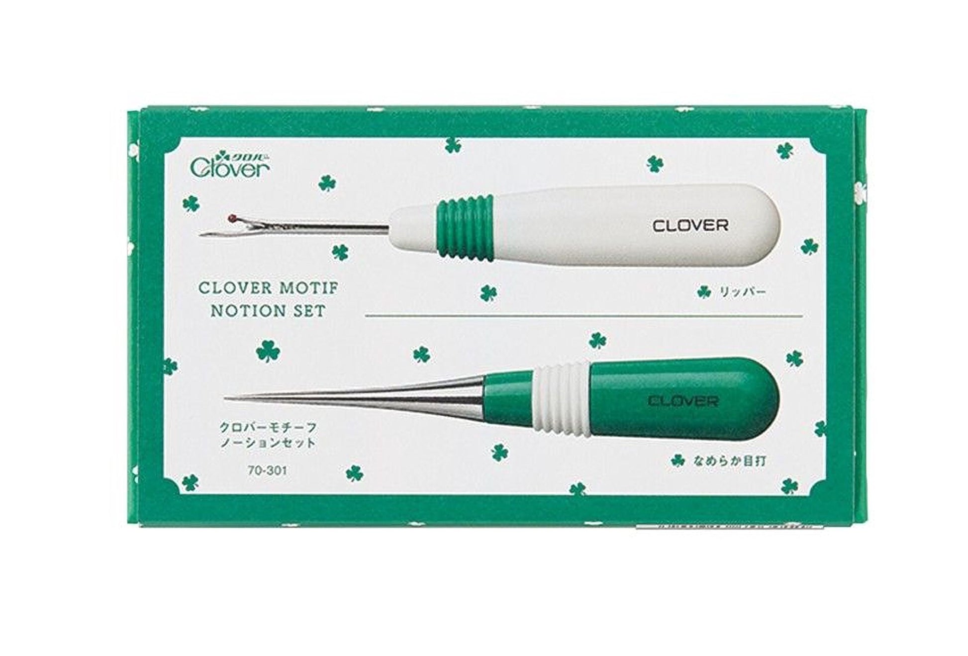 a set of sewing tools, including a needle and a pair of scissors, presented in a green and white box with a clover motif.