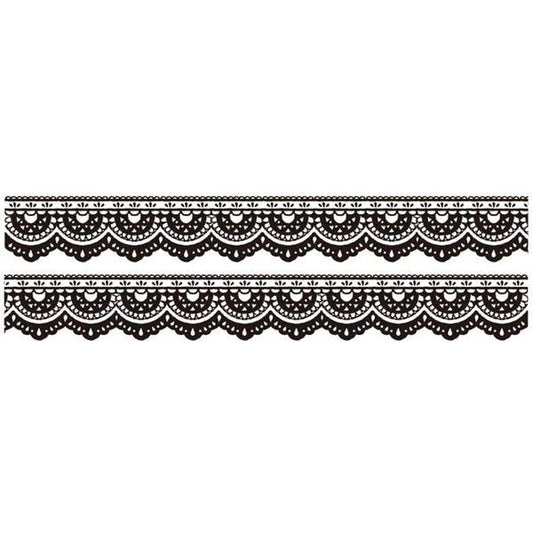 a repeating pattern of black and white lace-like designs on a white background.