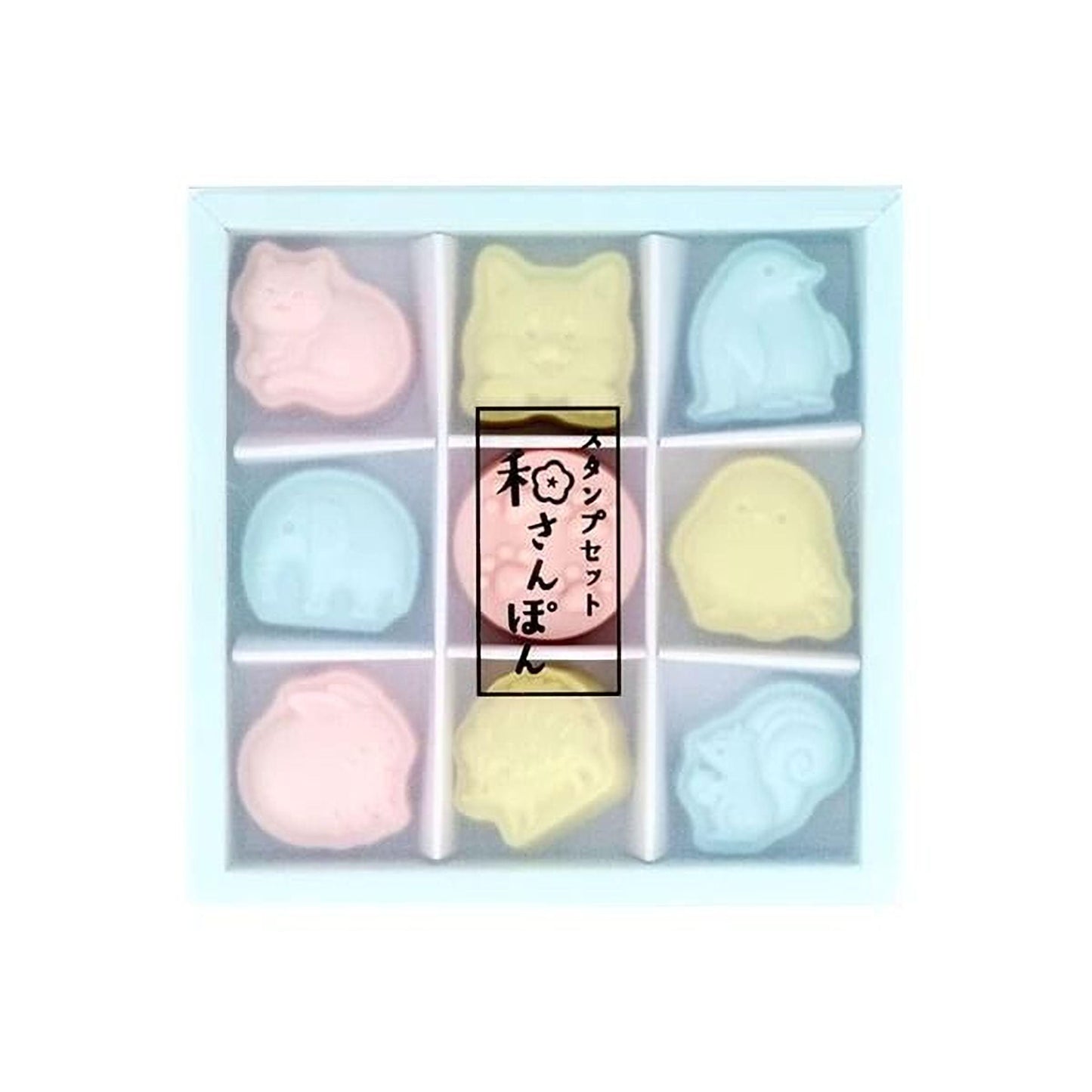 A white box containing nine colorful animal figurines, including a pink cat, a yellow cat, a blue penguin, a pink pig, a yellow pig, a blue cat, a pink pig, and a yellow cat.