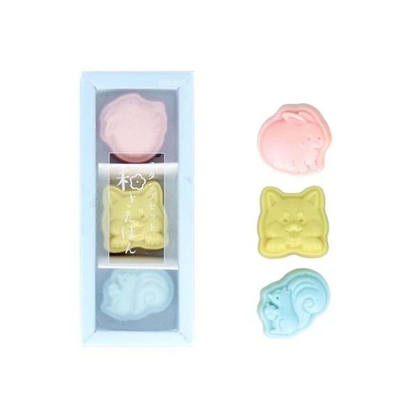 A set of four colorful animal-shaped soaps in a clear plastic box, with a blue lid.