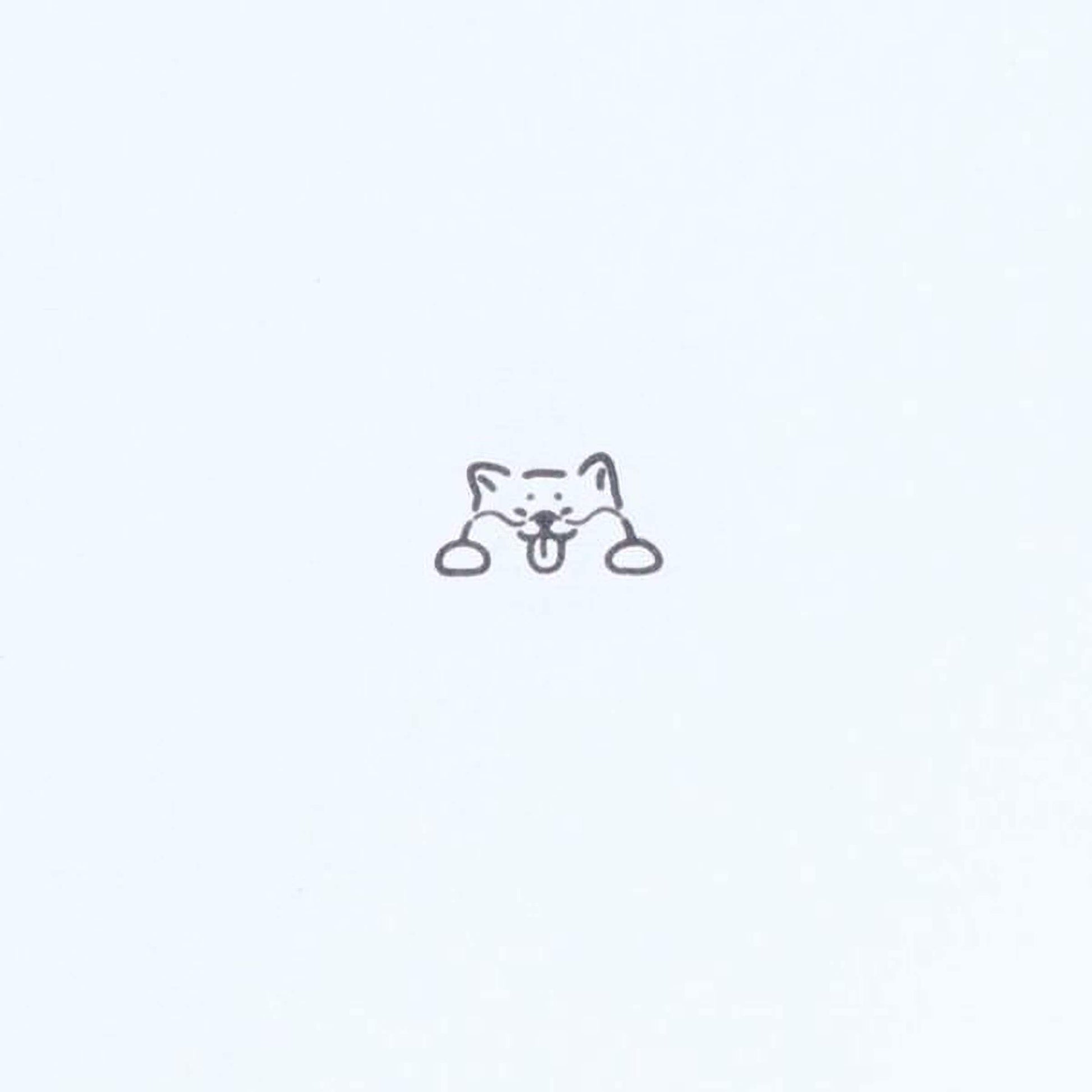 A simple line drawing of a cat's face with a small, playful expression.