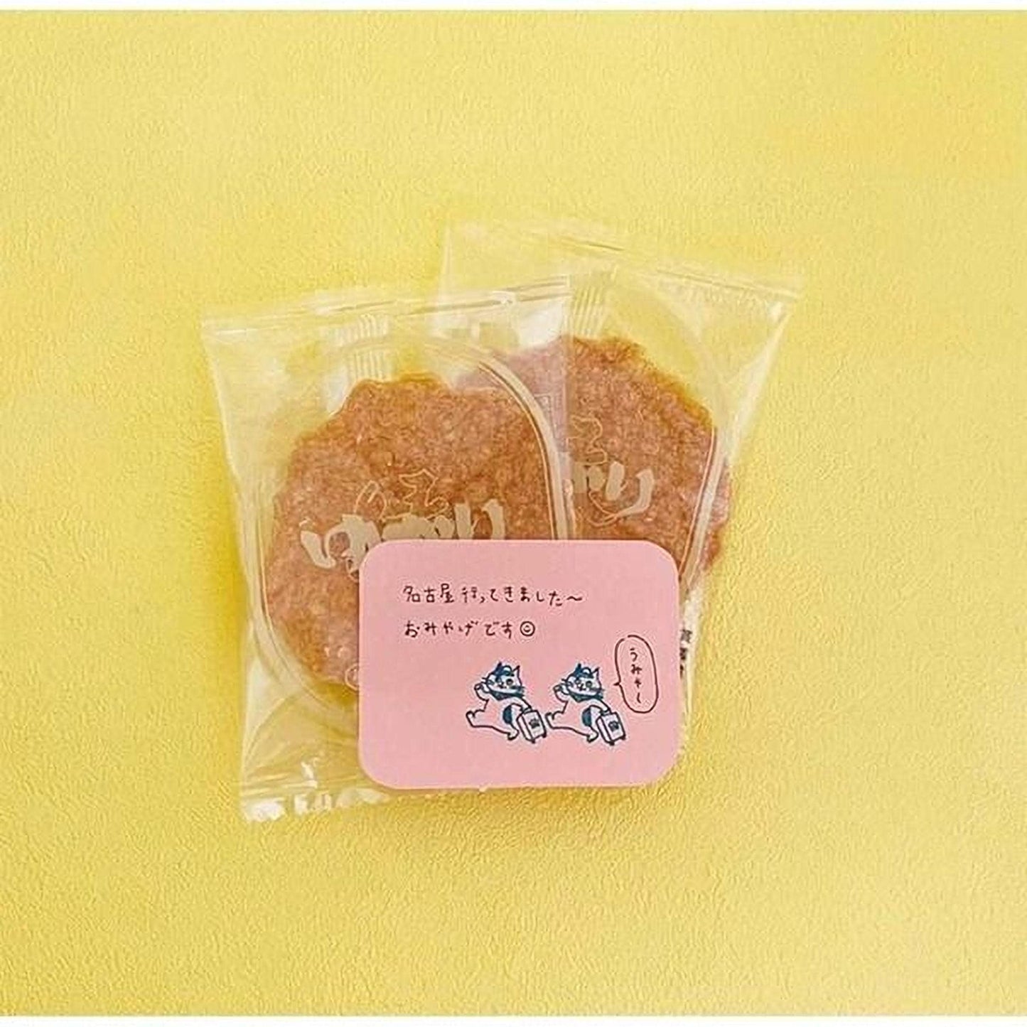 two packages of cookies placed on a yellow background.