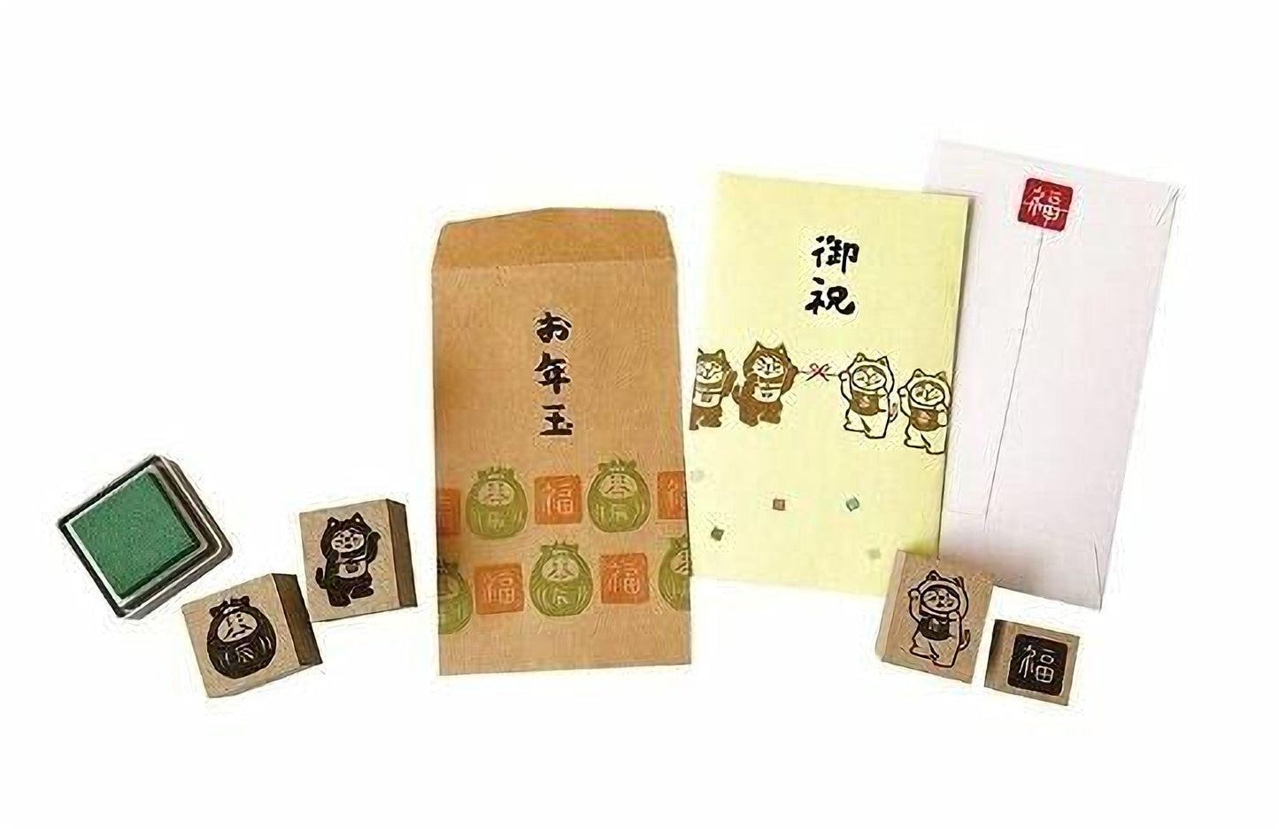 various items, including a stamp, an envelope, and some blocks, all of which appear to be related to Japanese culture or art.