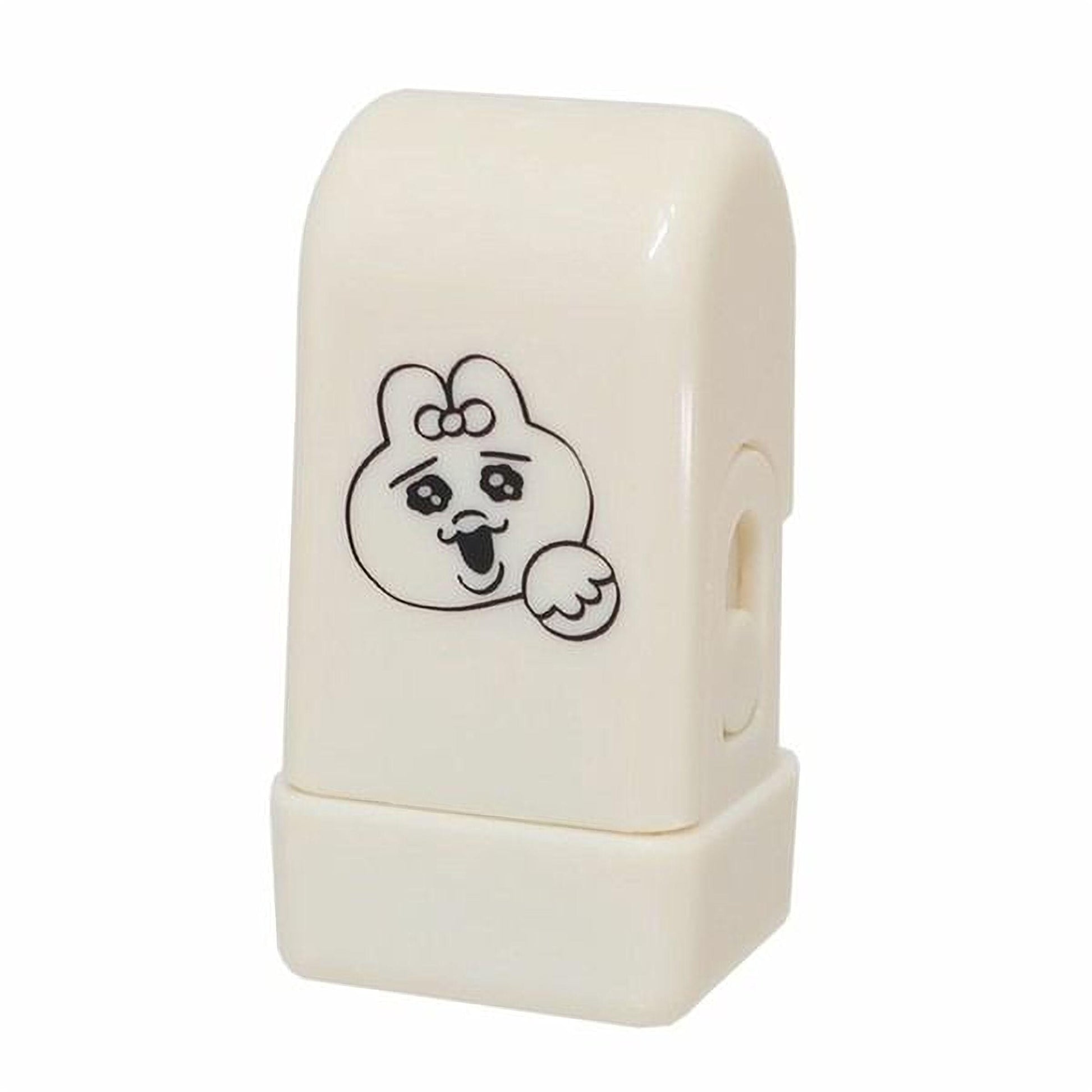 A white rubber stamp with a cartoon character on it.
