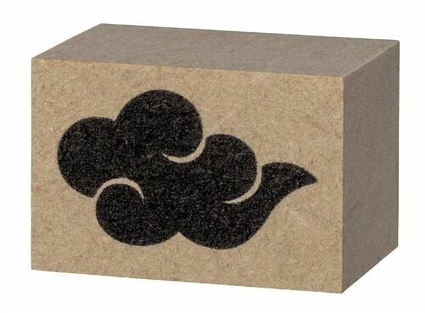 A block of brown cardboard with a black cloud-like symbol printed on it.