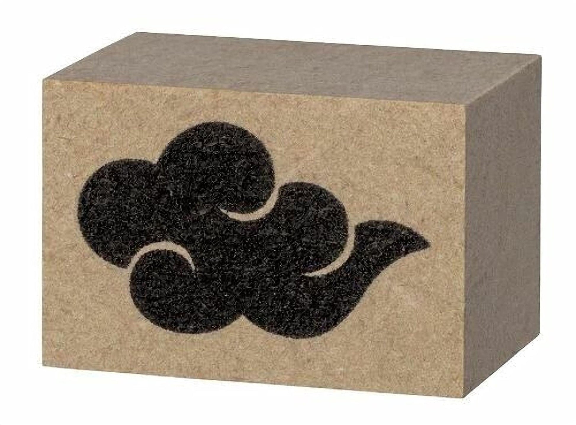 A block of brown cardboard with a black cloud-like symbol printed on it.