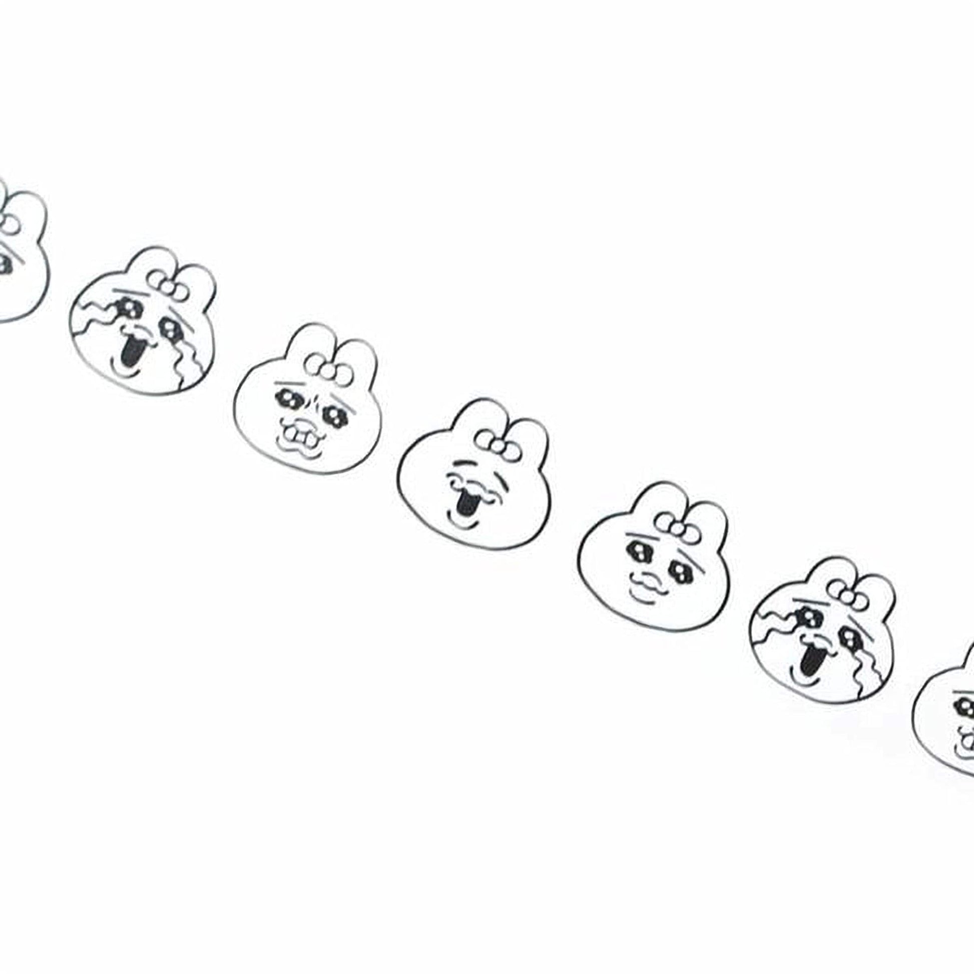 A row of simple black and white cartoon-style faces with exaggerated features, such as large eyes, big noses, and wide mouths, arranged in a diagonal line.
