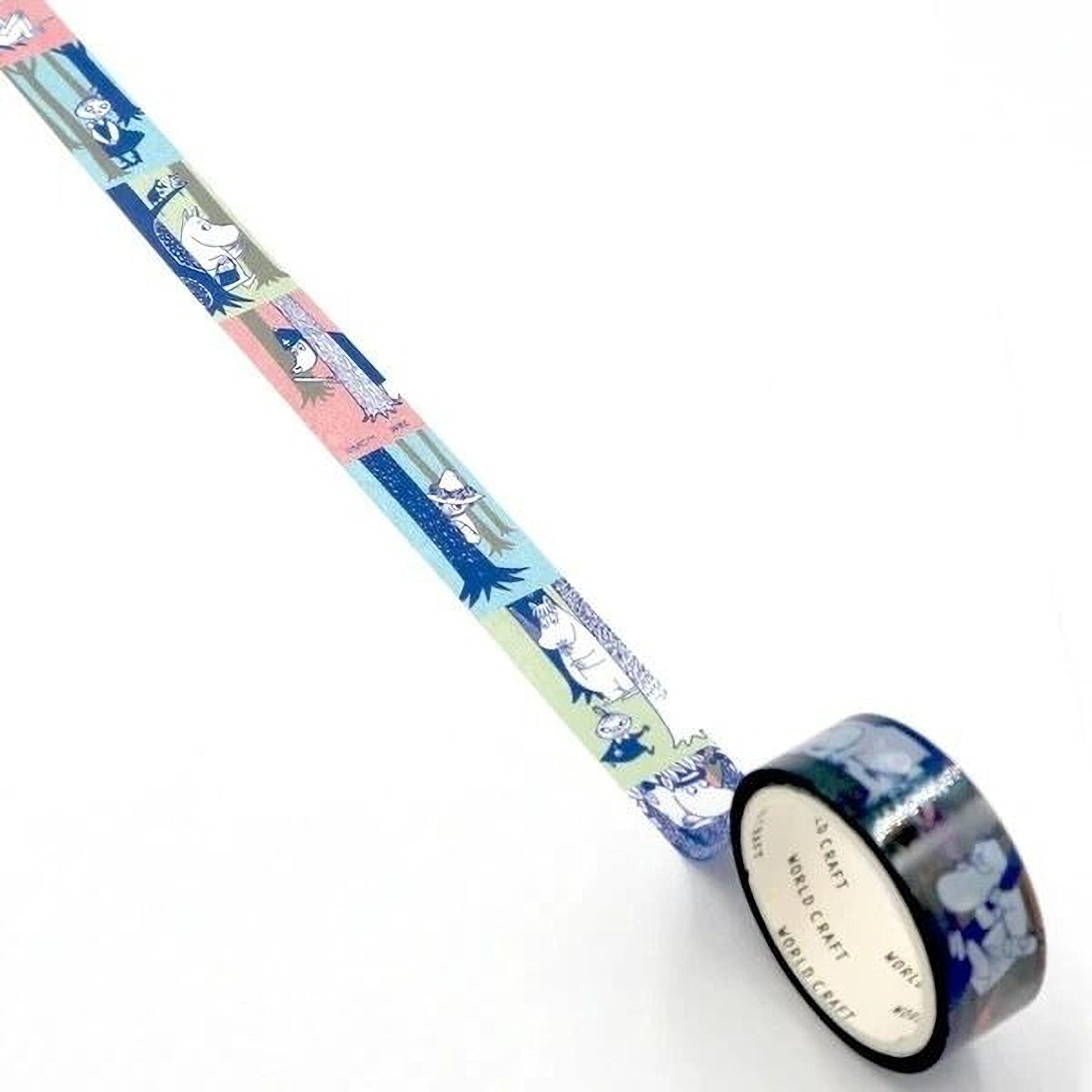 A roll of colorful washi tape with a pattern of cartoon characters on it, lying on a white surface.