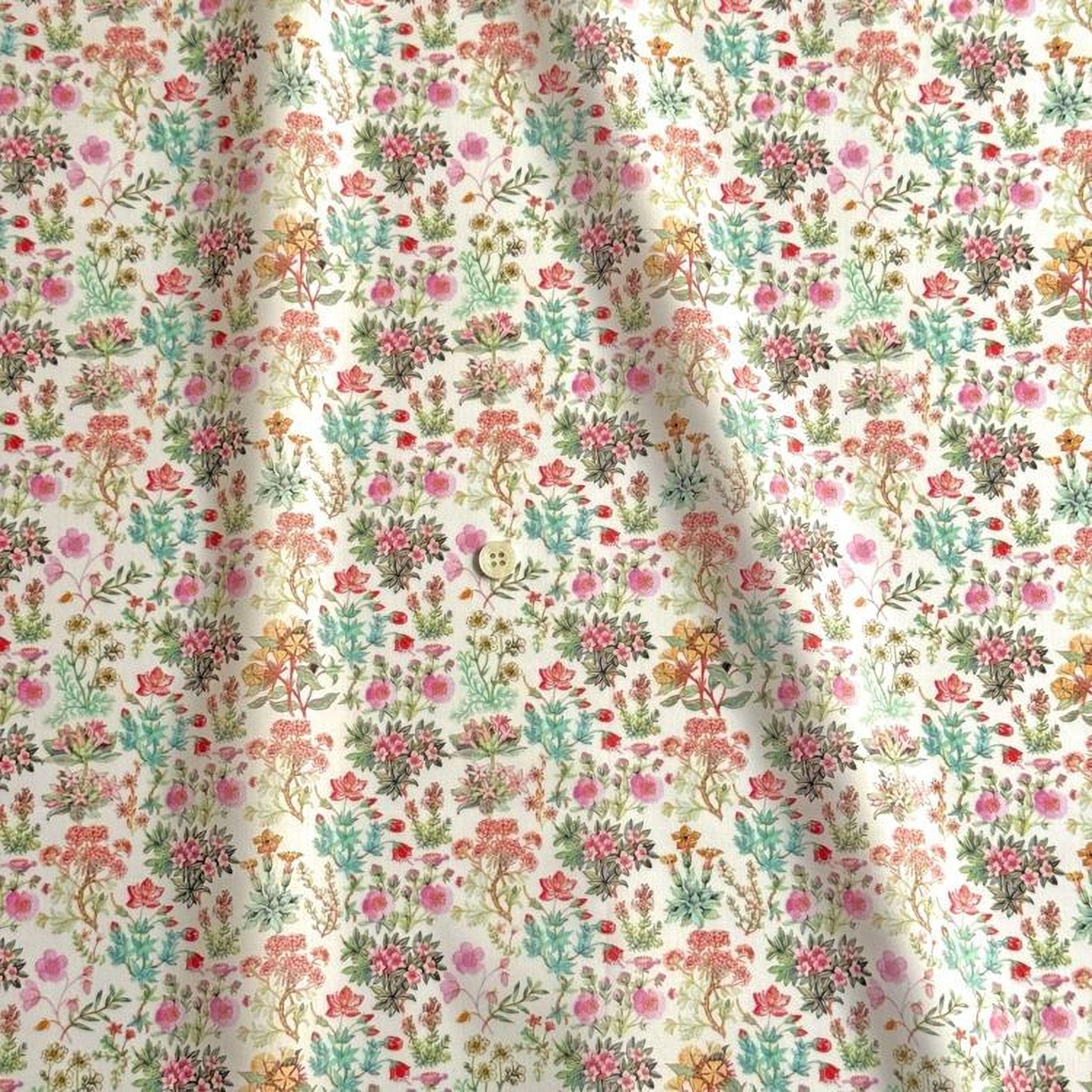 a close-up view of a fabric with a floral pattern. The pattern consists of various flowers and plants in different colors, including pink, green, yellow, and orange. The fabric appears to be made of a soft, light-colored material, possibly cotton or linen. The pattern is intricate and detailed, showcasing the craftsmanship and artistry involved in creating the fabric.