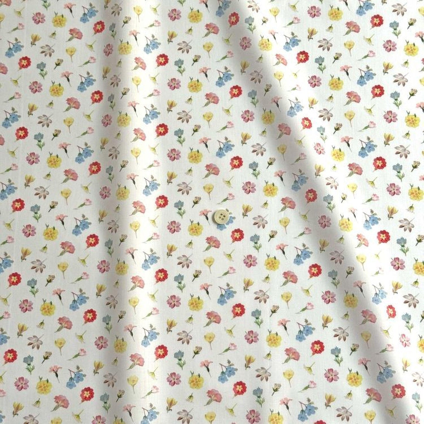 a repeating pattern of various colorful flowers on a white background.