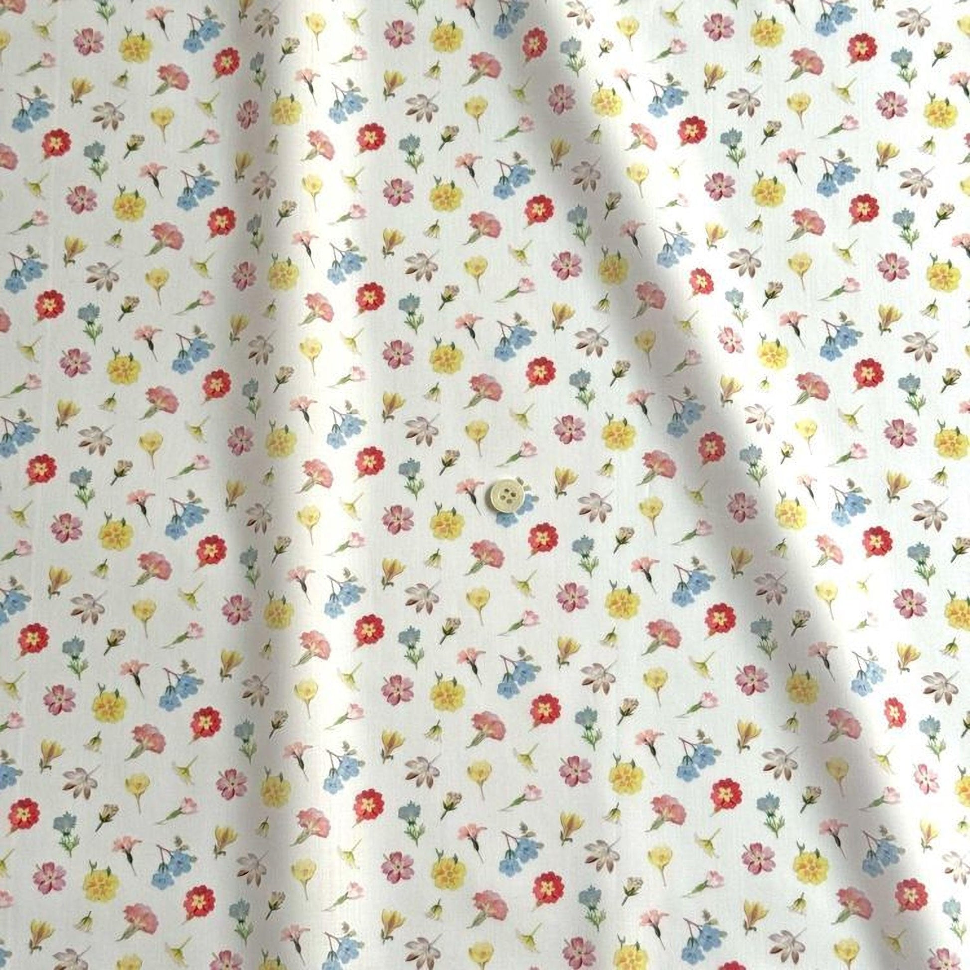 a repeating pattern of various colorful flowers on a white background.
