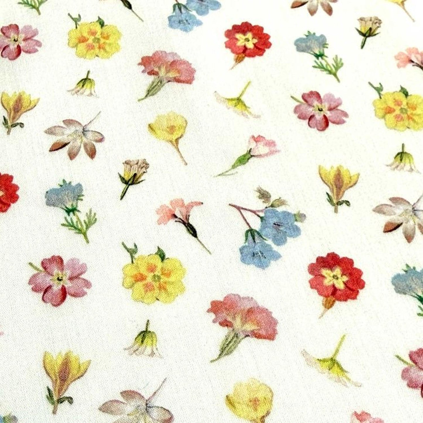 a variety of colorful flowers, including yellow, pink, blue, and red flowers, arranged in a repeating pattern across a white background.