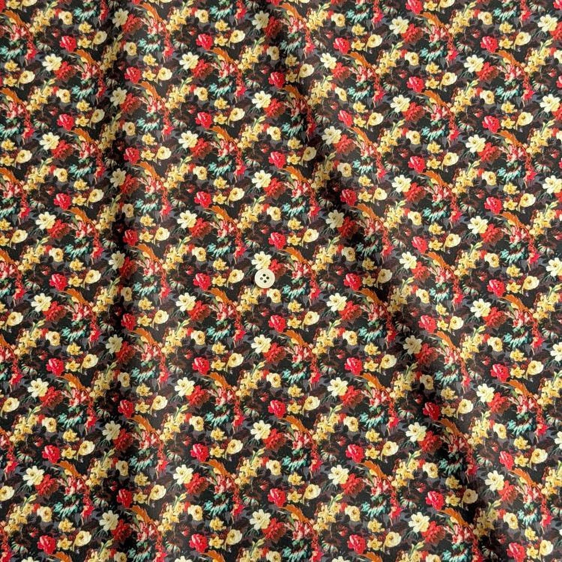 a close-up view of a fabric with a floral pattern. The fabric appears to be dark in color, with a repeating pattern of flowers in various colors, including red, yellow, and green. The pattern is intricate and detailed, creating a visually appealing design.