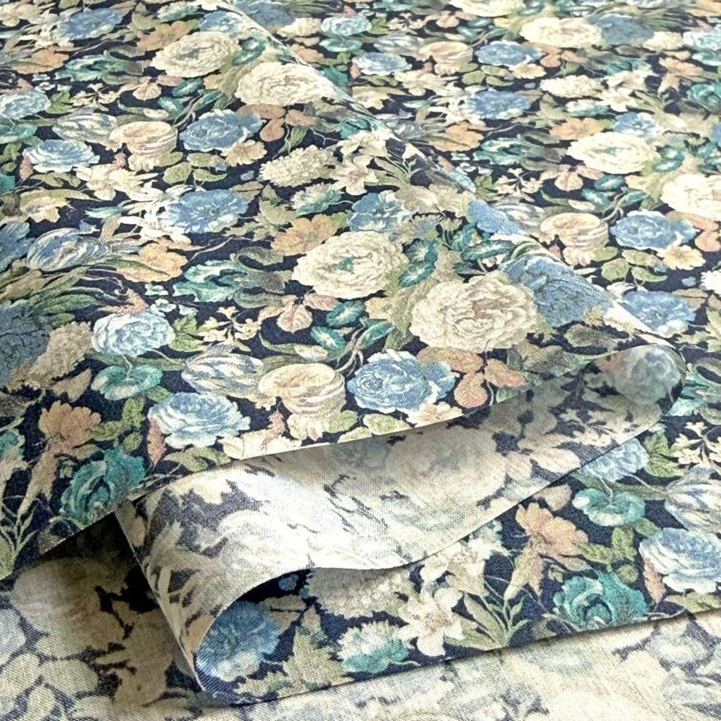 a close-up view of a fabric with a floral pattern, showcasing a variety of colors and shapes.