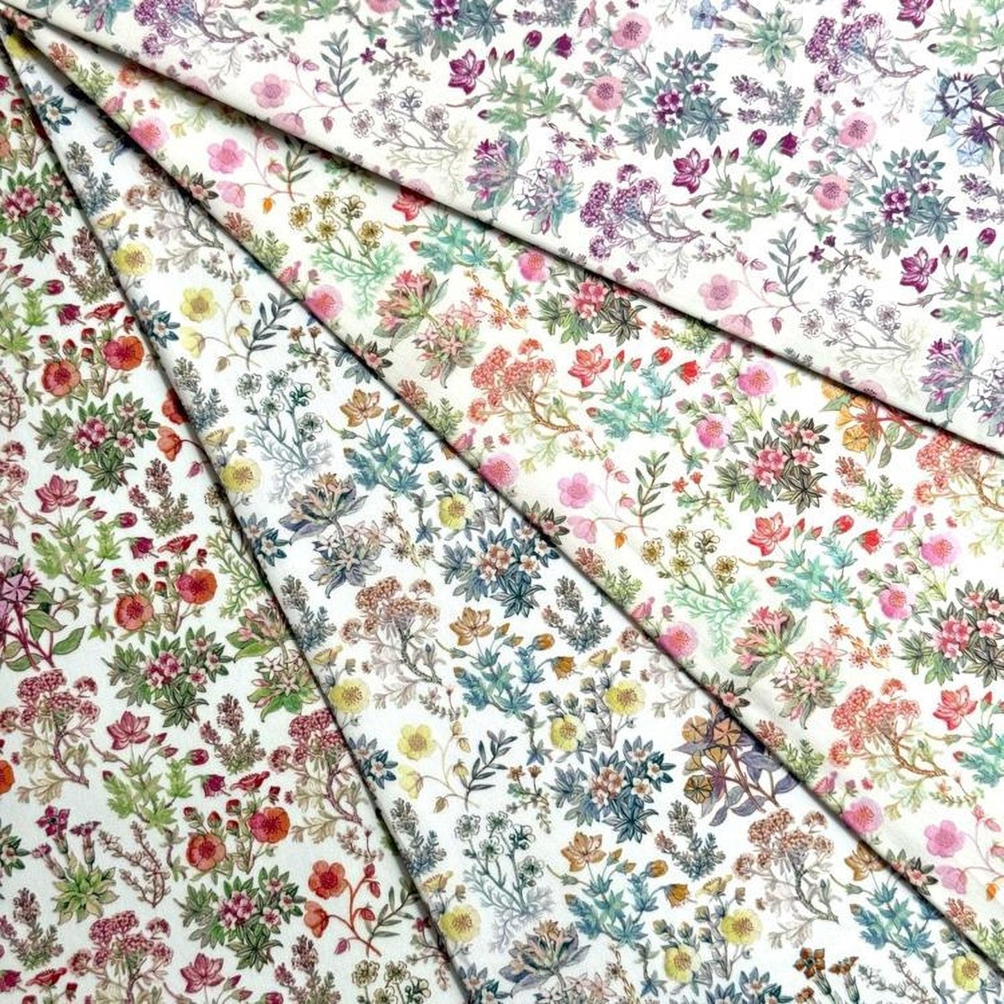 The image is a collage of various floral patterns, featuring a range of colors and designs. The patterns include a variety of flowers, leaves, and other natural elements, creating a visually appealing and diverse collection.