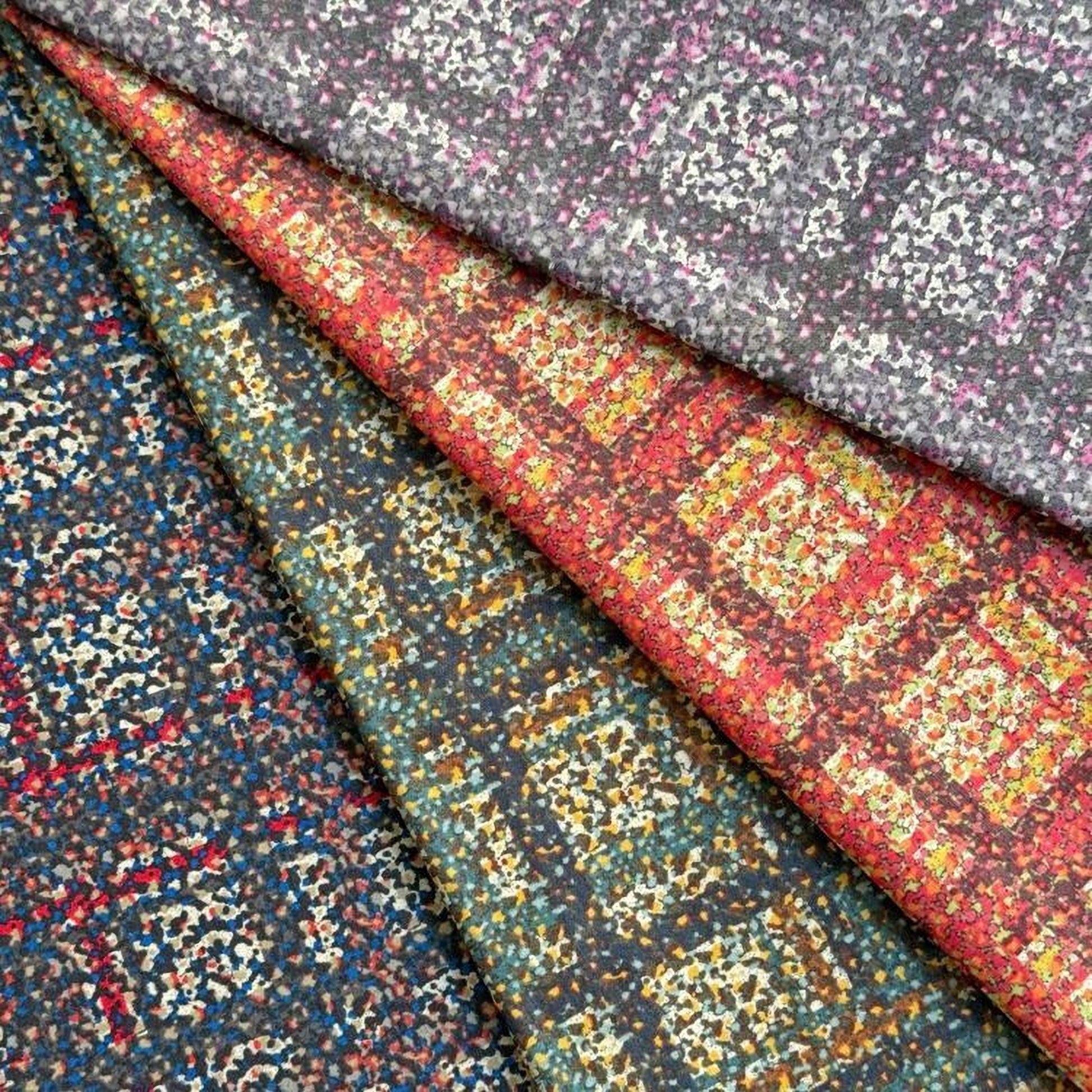 a collection of colorful fabric swatches, each with a unique pattern and color scheme.