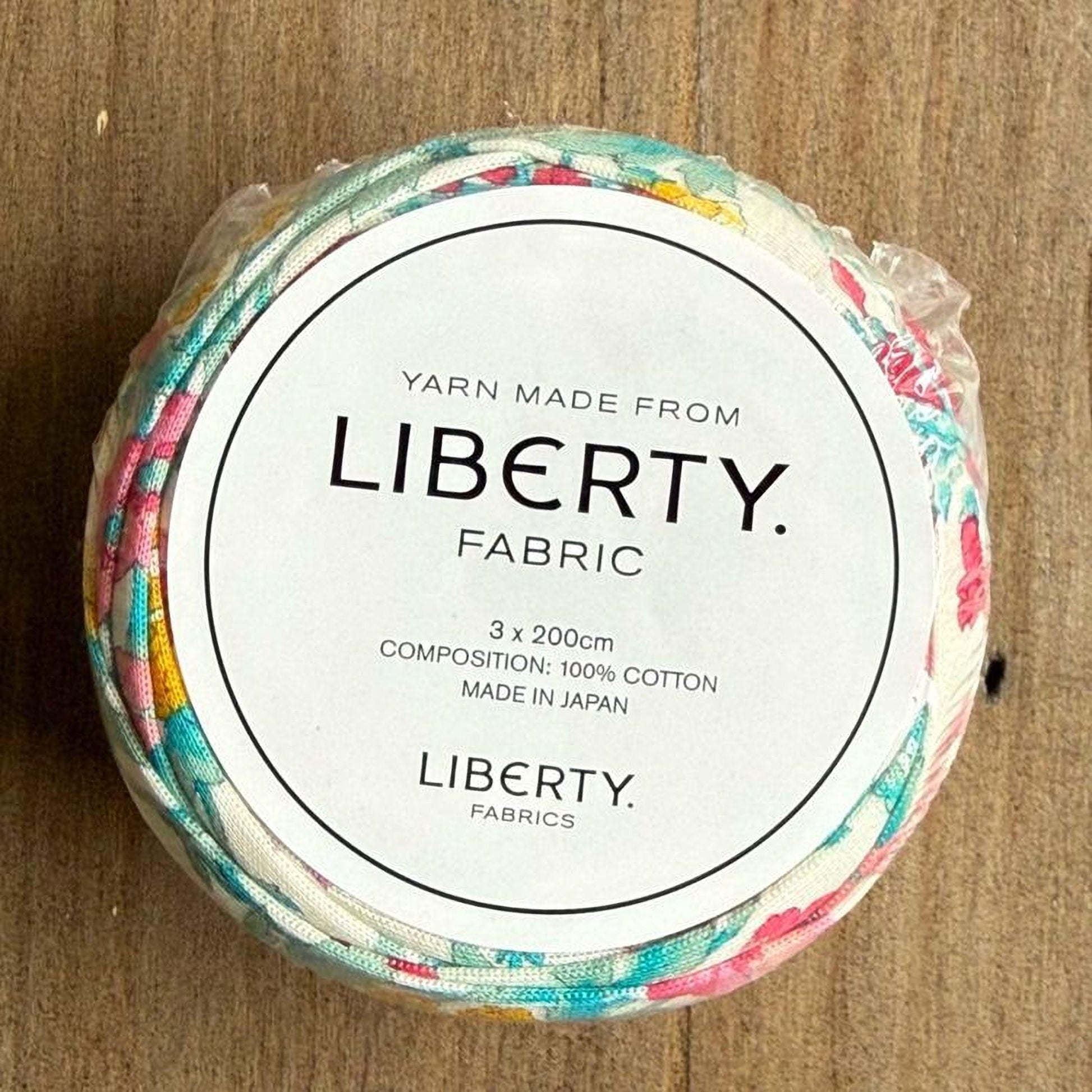 A package of Liberty fabric spools, made from 100% cotton and manufactured in Japan.
