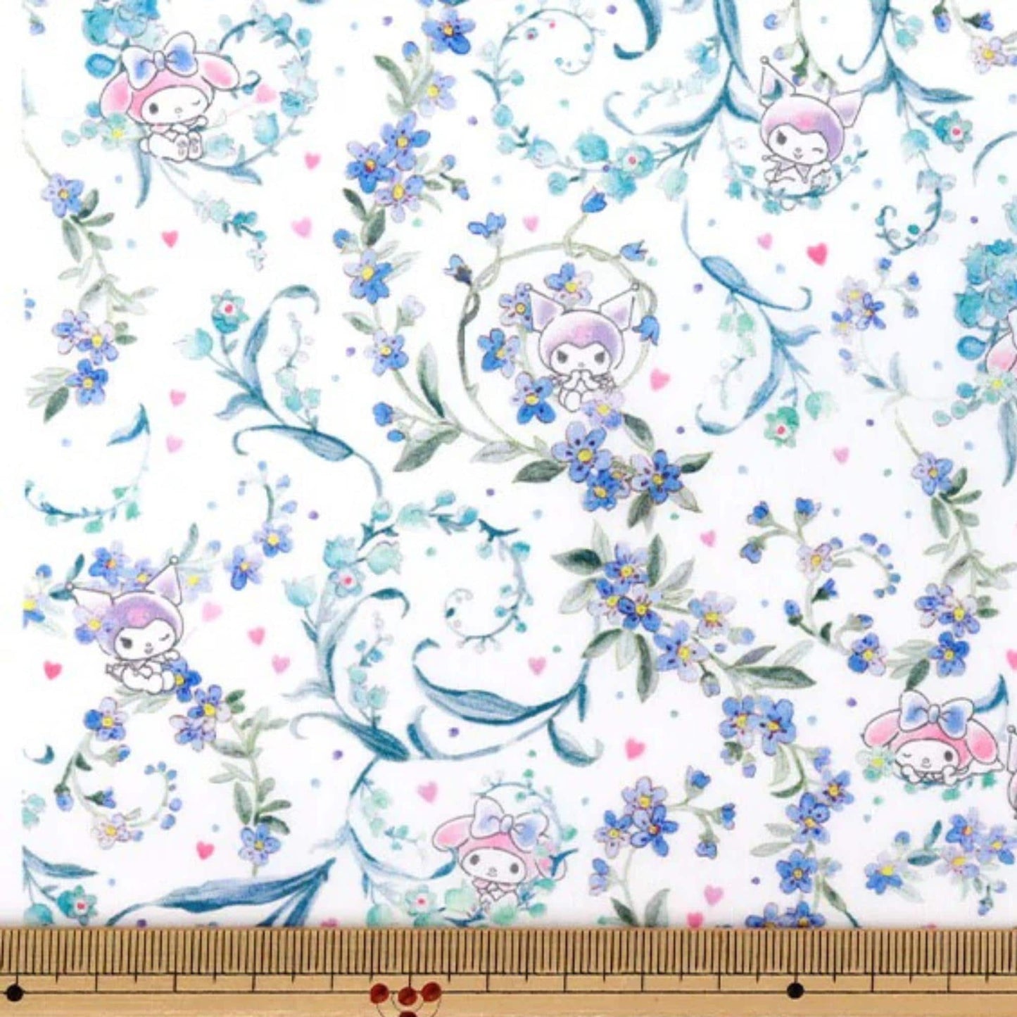 a repeating floral pattern with purple flowers and pink and white characters, including a character with a bow. The pattern is spread across a white background, and there are small pink and white flowers scattered throughout the design.