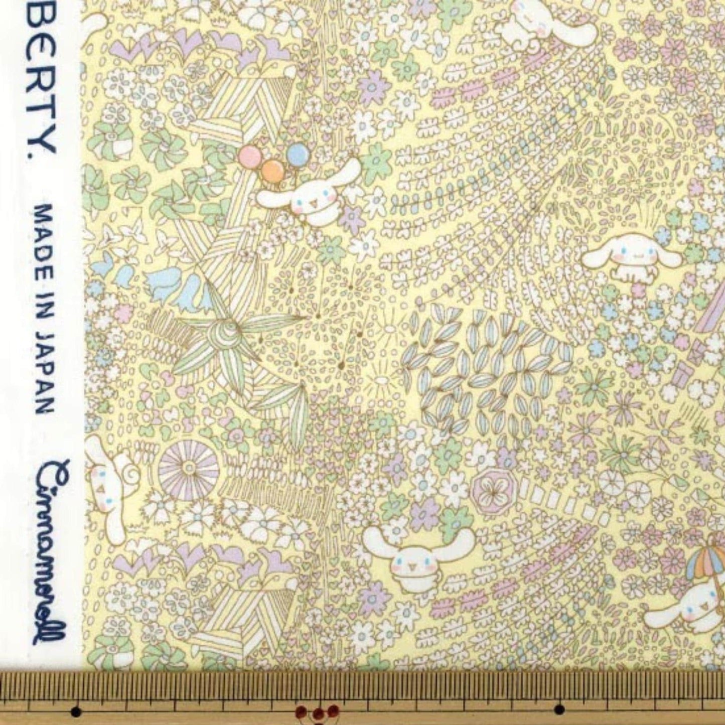 The image is a vibrant and colorful fabric with a repeating pattern of various elements, including flowers, leaves, and small animals. The fabric appears to be made of a material that resembles paper, with a yellow and green color scheme. The image is not a single, continuous scene but rather a collage of multiple images that come together to create a larger, more intricate pattern.
