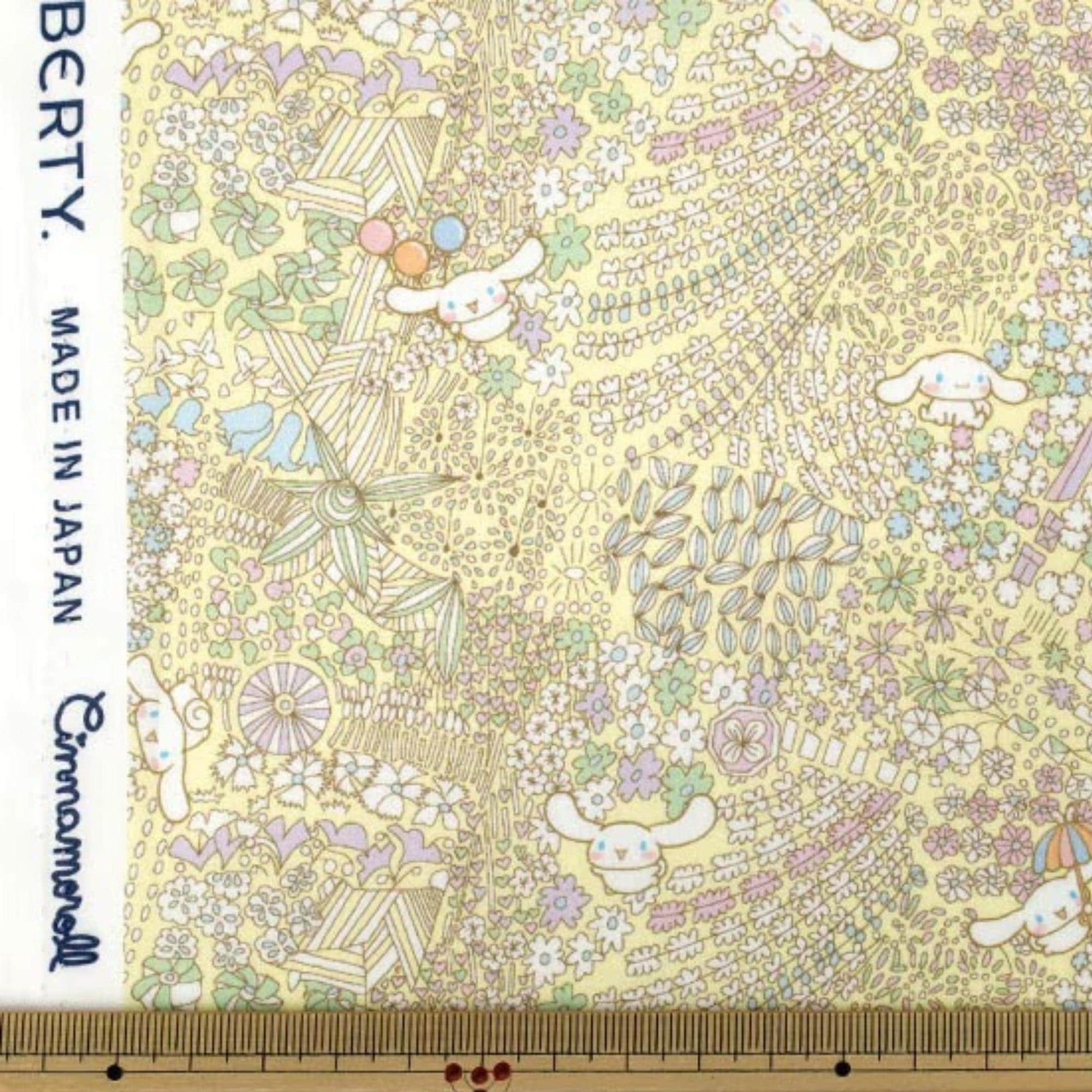 The image is a vibrant and colorful fabric with a repeating pattern of various elements, including flowers, leaves, and small animals. The fabric appears to be made of a material that resembles paper, with a yellow and green color scheme. The image is not a single, continuous scene but rather a collage of multiple images that come together to create a larger, more intricate pattern.