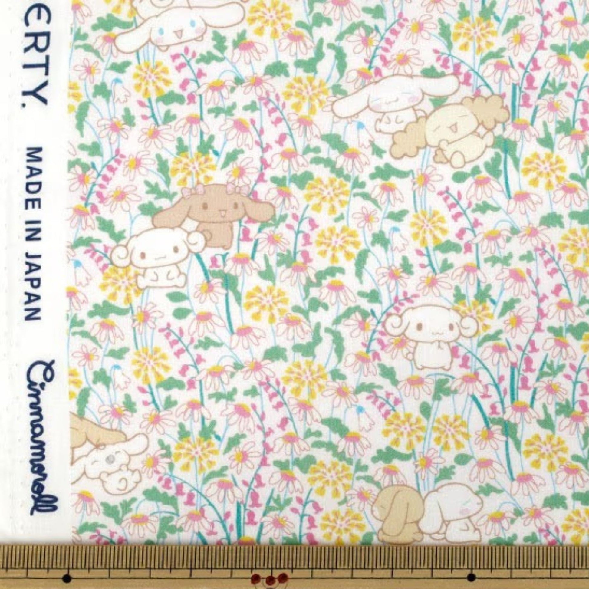 a pattern of cartoon-style animals, including rabbits, flowers, and other small creatures, arranged in a floral design.