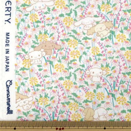 a pattern of cartoon-style animals, including rabbits, flowers, and other small creatures, arranged in a floral design.