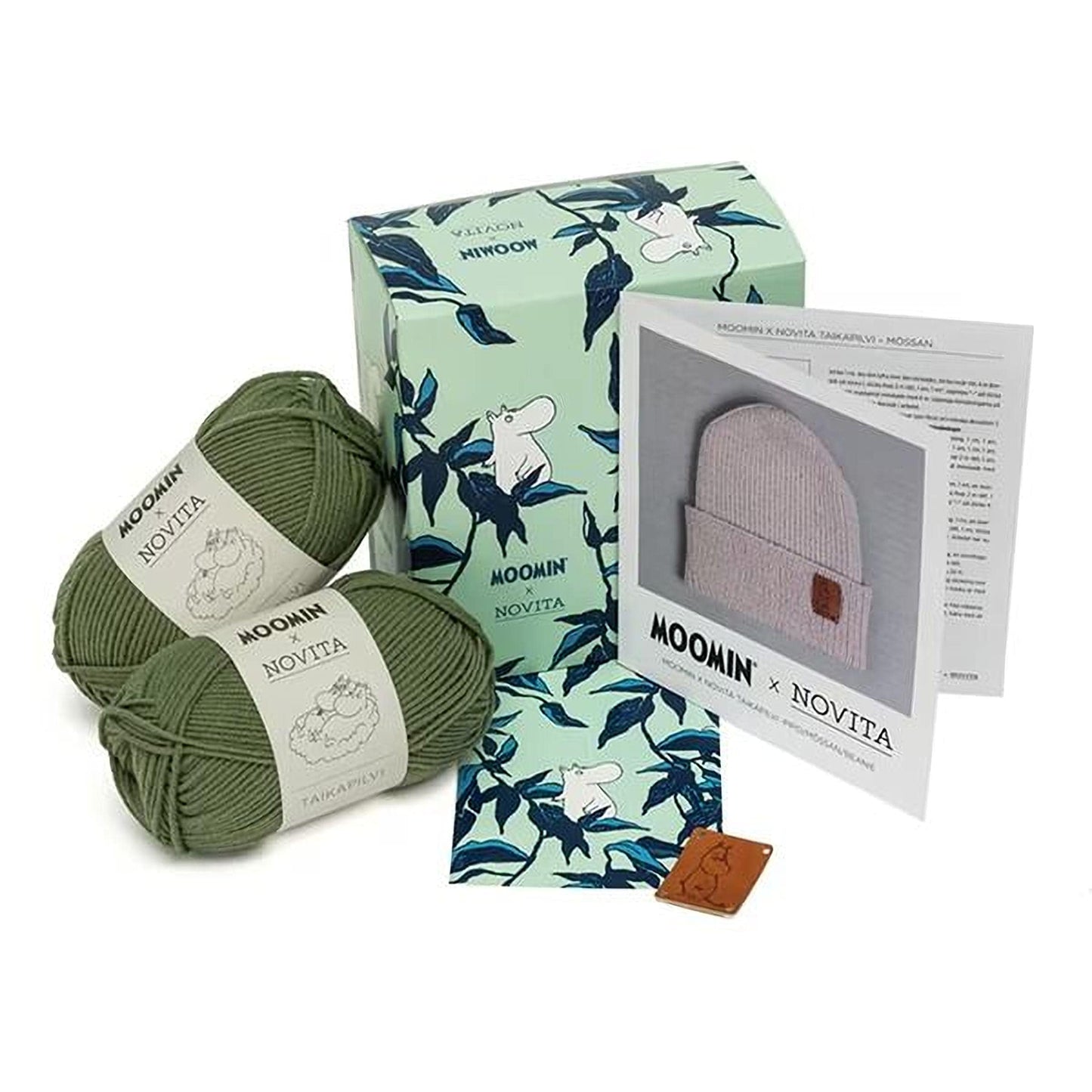 a collection of items related to knitting, including yarn, a box, a booklet, and a tag.