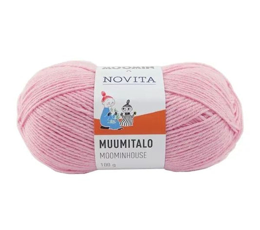 a ball of pink yarn labeled "Muumitalo" and "Moominhouse" with a label that includes a cartoon character. The yarn is packaged in a white and orange label, and there is text in both English and Japanese.