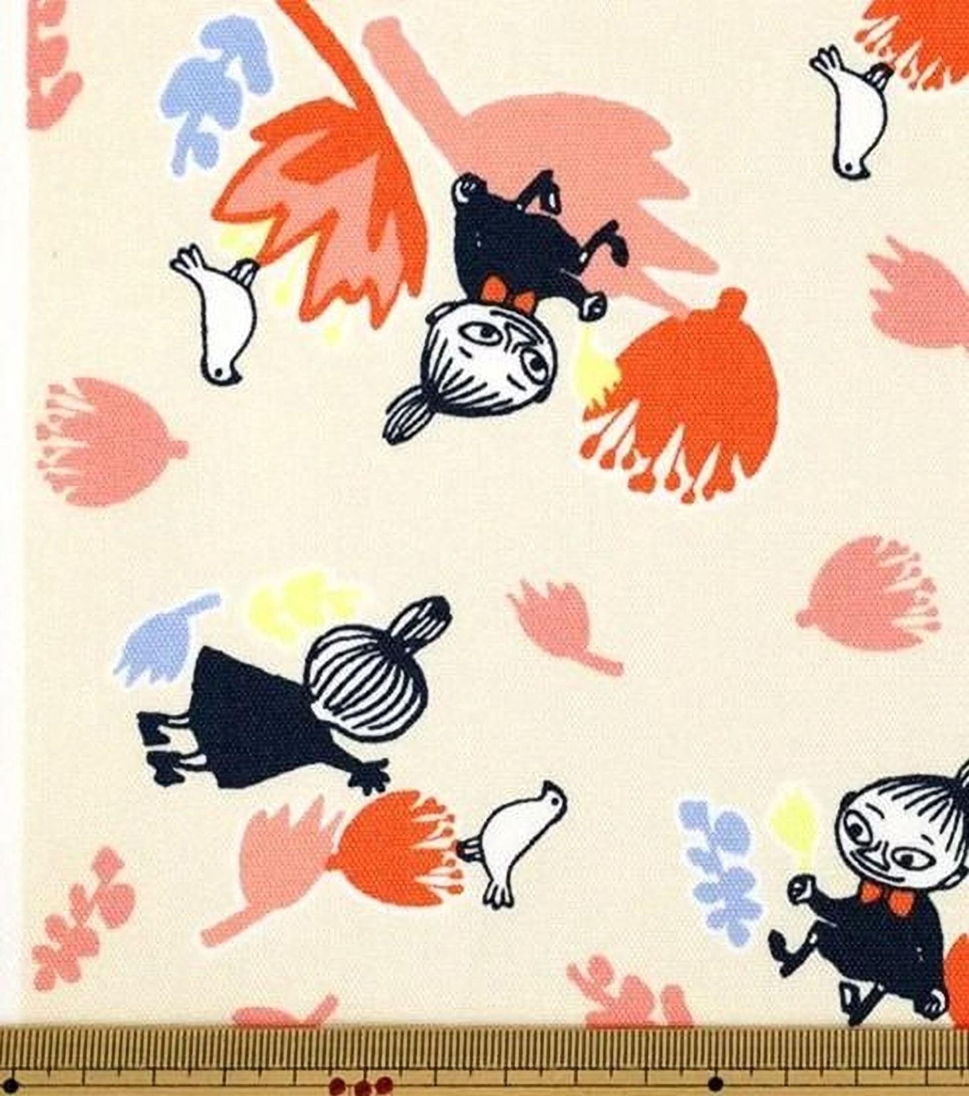 The image is a fabric print featuring a playful and whimsical design with various cartoon-like characters and floral elements.
